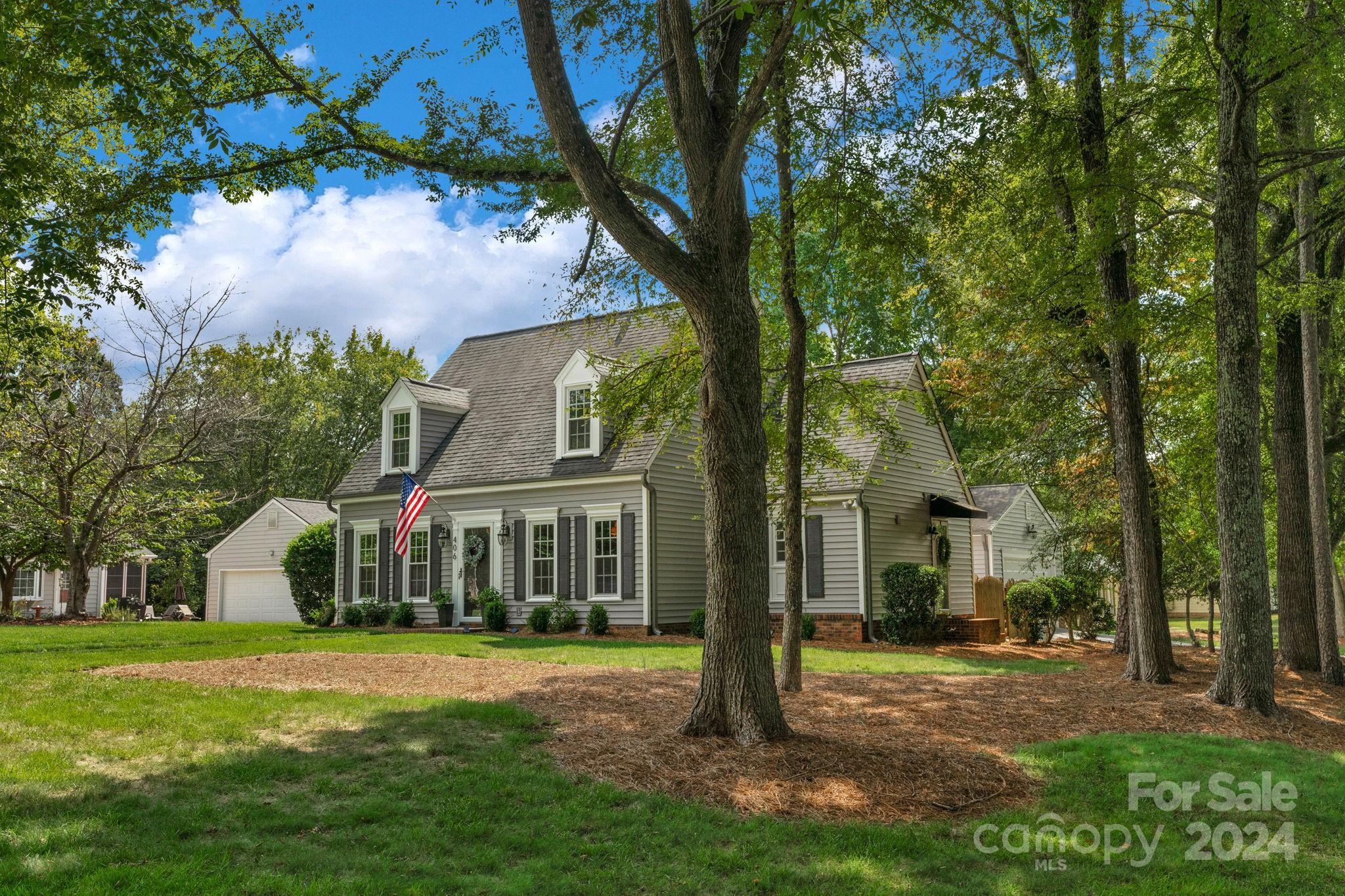 406 Sandymead Road Matthews, NC 28105 - Photo 47 of 48 a view of a house next to a big yard and large trees