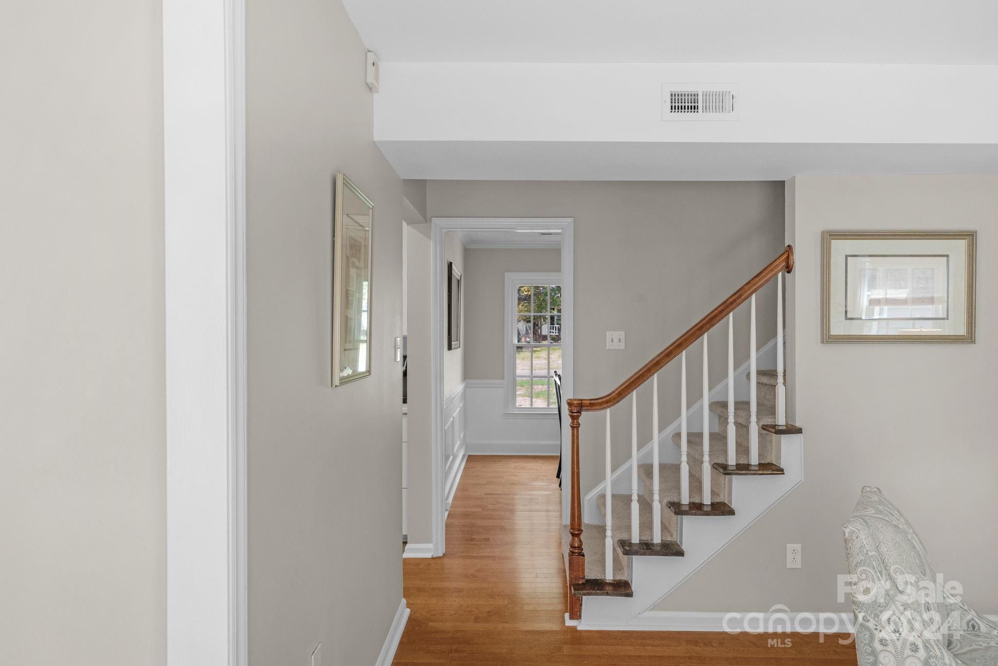 406 Sandymead Road Matthews, NC 28105 - Photo 8 of 48 a view of entryway and hall with wooden floor