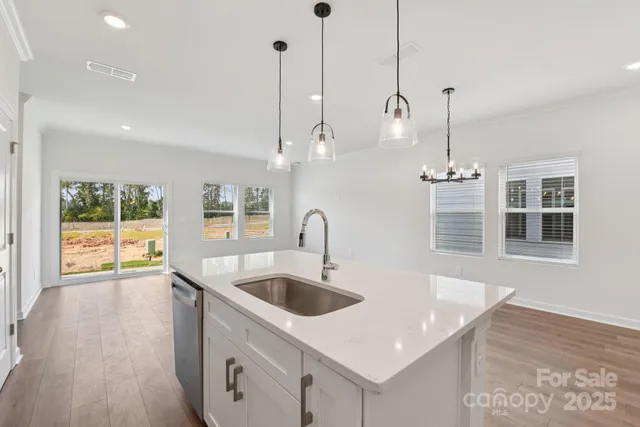 a kitchen with sink and window