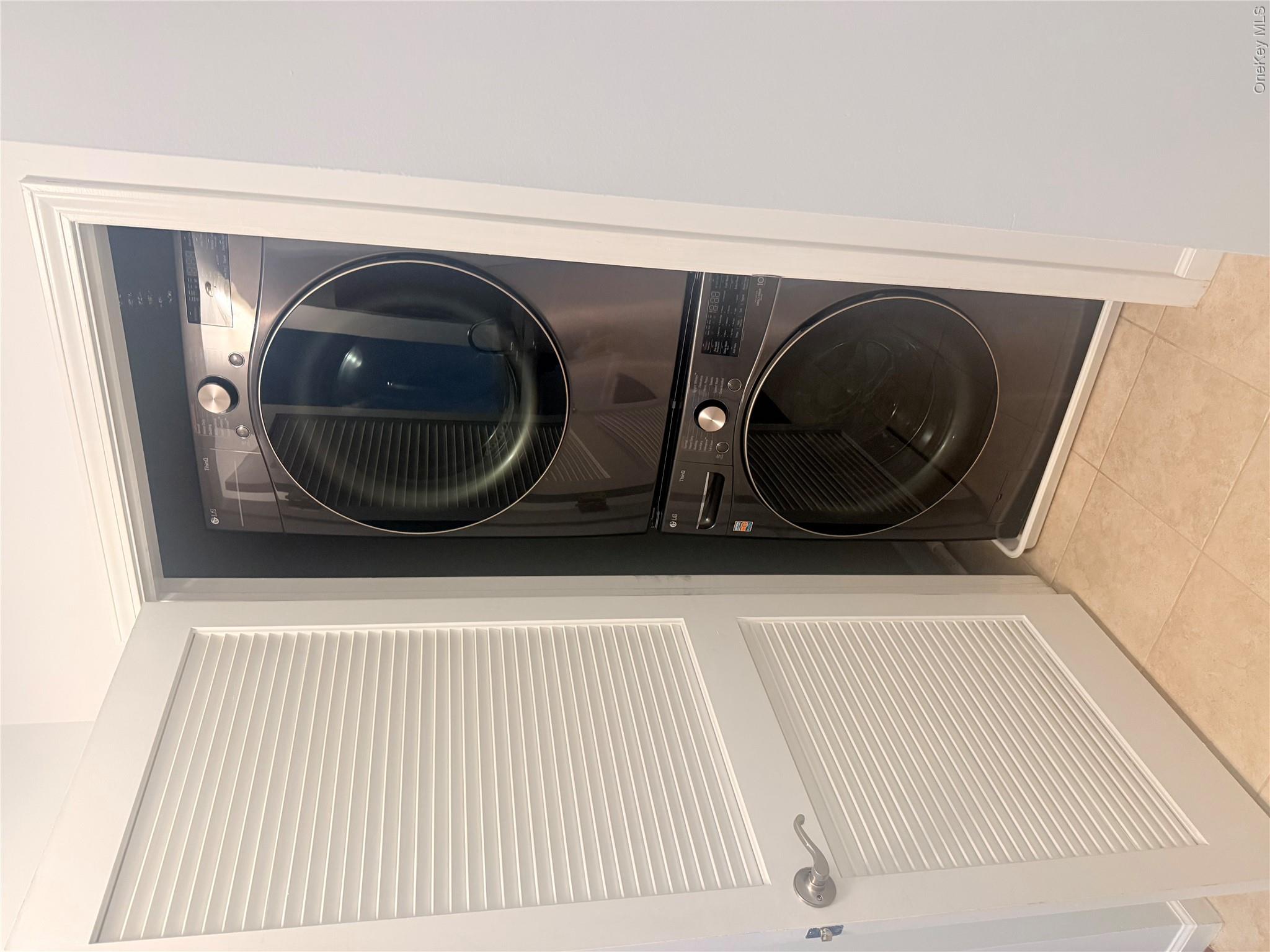 935 Tower Ridge Circle Middletown, NY 10941 - Photo 14 of 24 Stackable washer and dryer unit within a dedicated utility closet