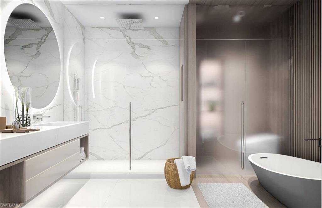1925 Metropolitan Boulevard, Unit 1106 Naples, FL 34104 - Photo 17 of 21 Full bath featuring double vanity, a marble finish shower, a freestanding bath, and stone wall