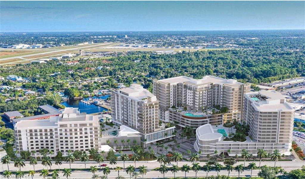 1925 Metropolitan Boulevard, Unit 1106 Naples, FL 34104 - Photo 2 of 21 View of urban area featuring a large body of water