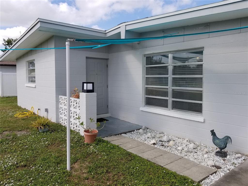 1304 Mango Avenue Venice, FL 34285 - Photo 1 of 1 a front view of a house with a yard