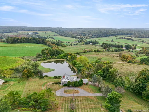 an aerial view of a houses with outdoor space and a lake view