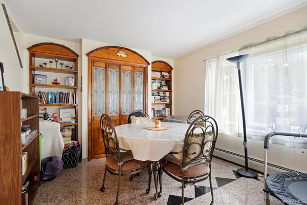 a room with lots of chairs and mirrors
