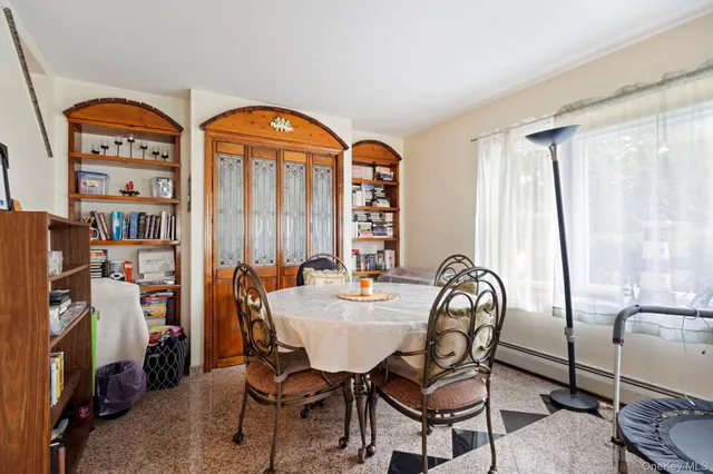 a room with lots of chairs and mirrors