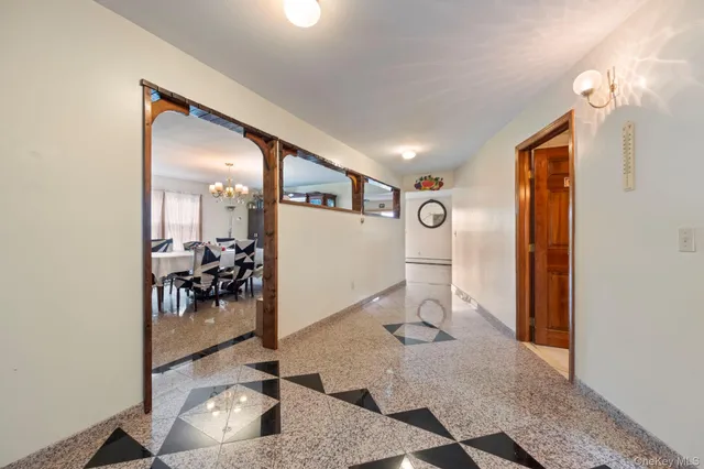 a view of a dining room with furniture and window
