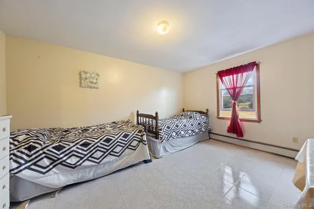 a spacious bathroom with a tub a double vanity sink and a mirror