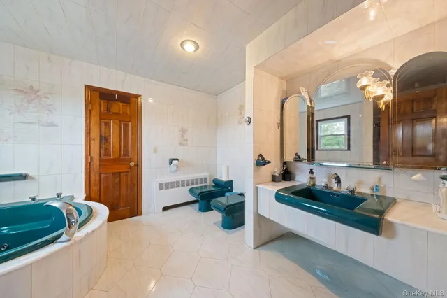 a view of a livingroom with furniture and stairs