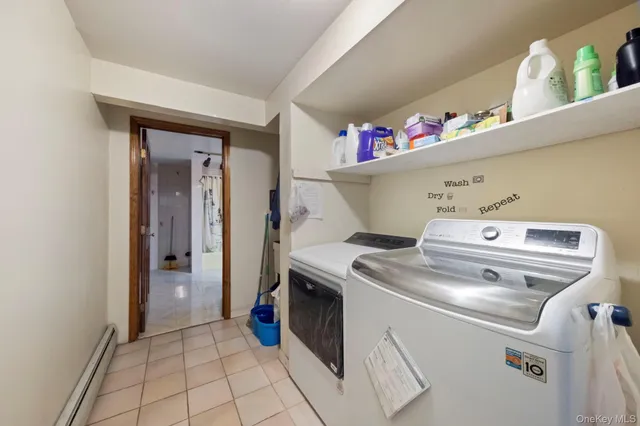 an aerial view of residential houses with outdoor space and pool