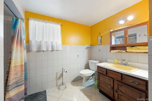 an aerial view of residential houses with outdoor space and pool