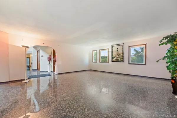 a kitchen with stainless steel appliances granite countertop a sink a stove and a refrigerator