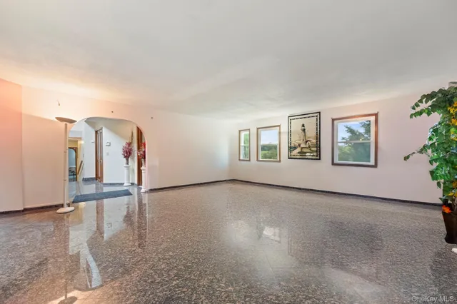 a kitchen with stainless steel appliances granite countertop a sink a stove and a refrigerator