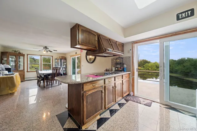 a kitchen with a stove a refrigerator and wooden cabinets