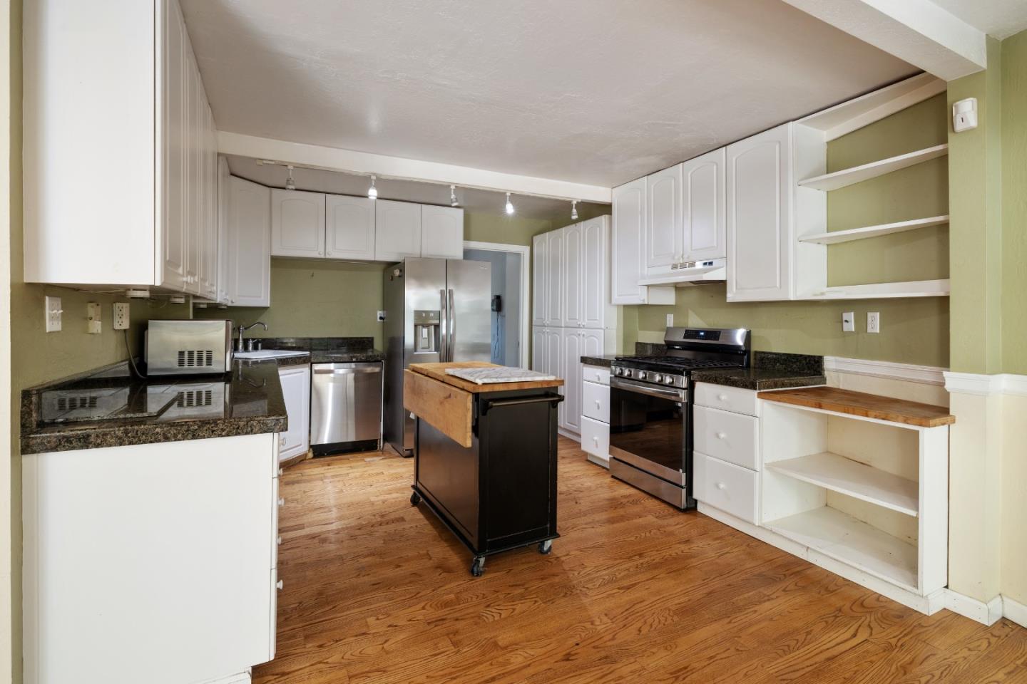 600 Cook Way Ben Lomond, CA 95005 - Photo 12 of 85 a kitchen with granite countertop a stove top oven and cabinets