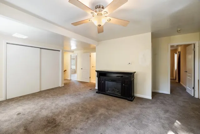 a white toilet sitting next to a bathroom sink