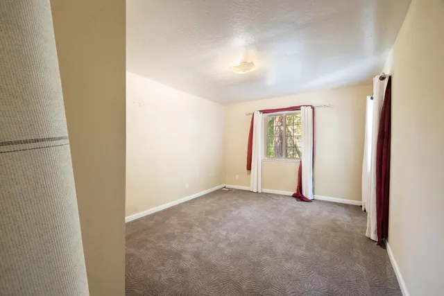 a view of a porch with wooden floor and outdoor space