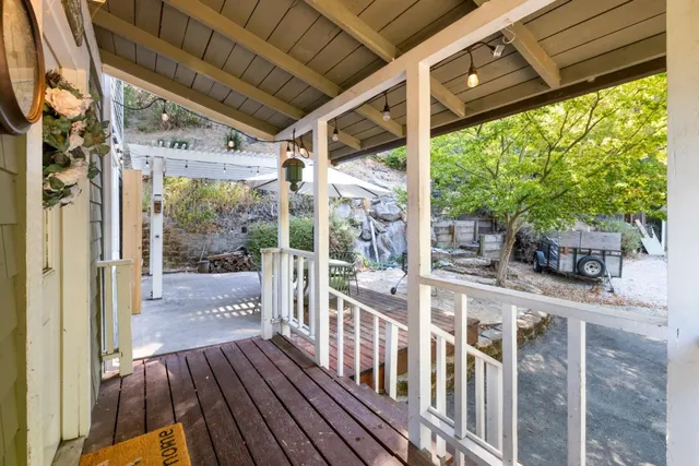 a view of a balcony with wooden floor