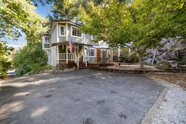 a front view of a house with a yard
