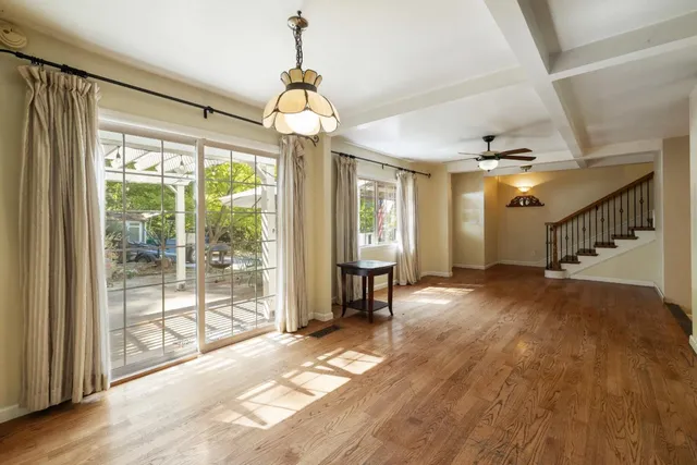 a kitchen with a refrigerator stove top oven and sink
