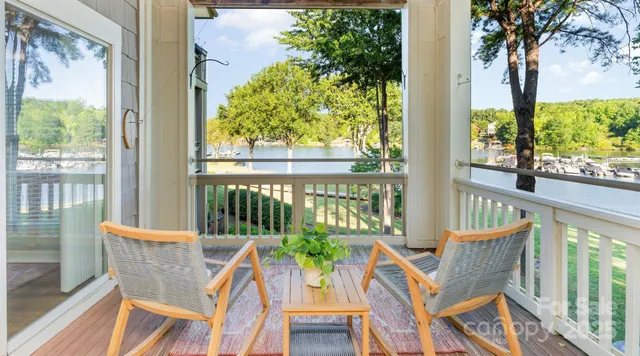 a view of a chair and table in the balcony