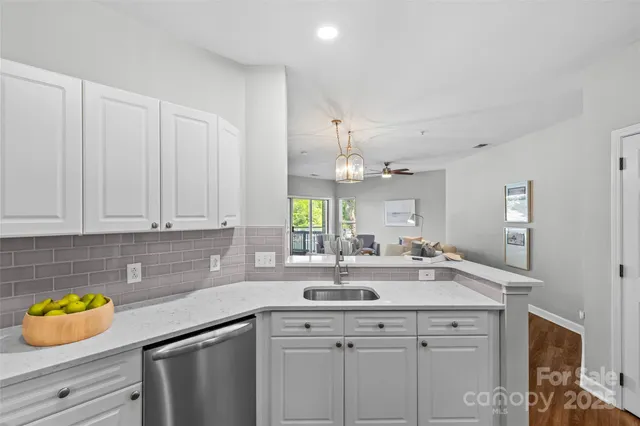 a kitchen with a sink and cabinets
