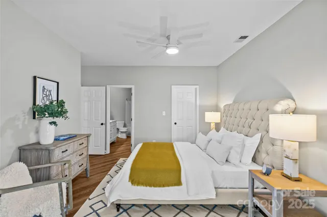 a bed room with a bed and a lamp