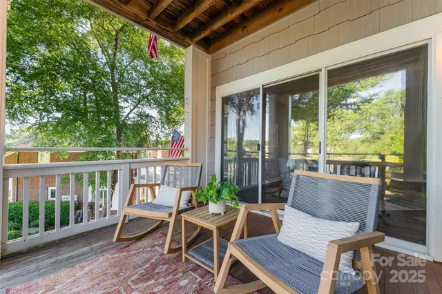 a view of a two chairs in the deck