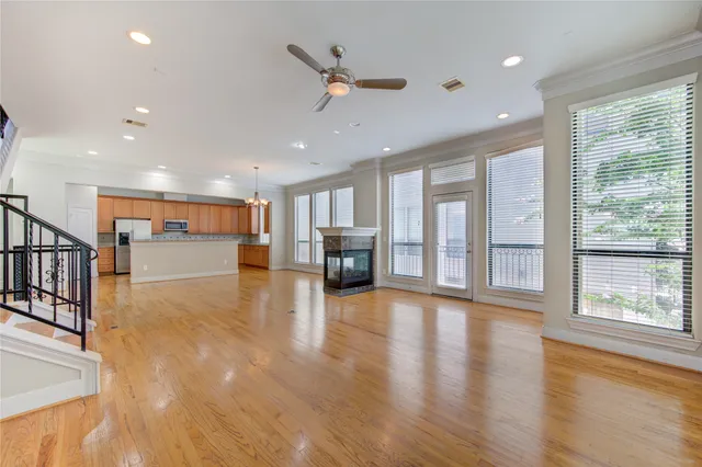 a view of a livingroom with furniture wooden floor and a window