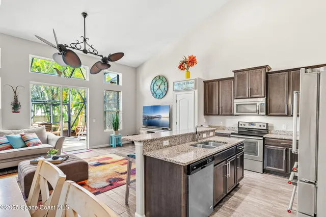 a view of kitchen with furniture and wooden floor