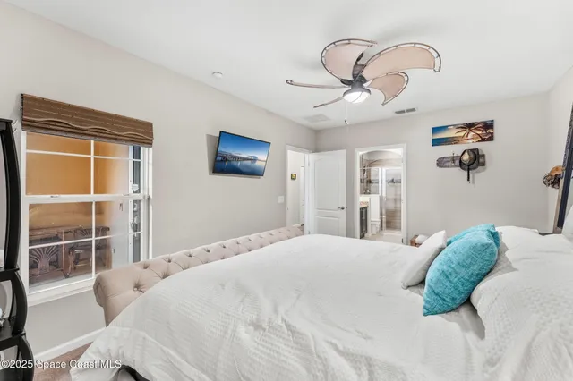 a bathroom with a granite countertop sink a toilet a mirror and shower