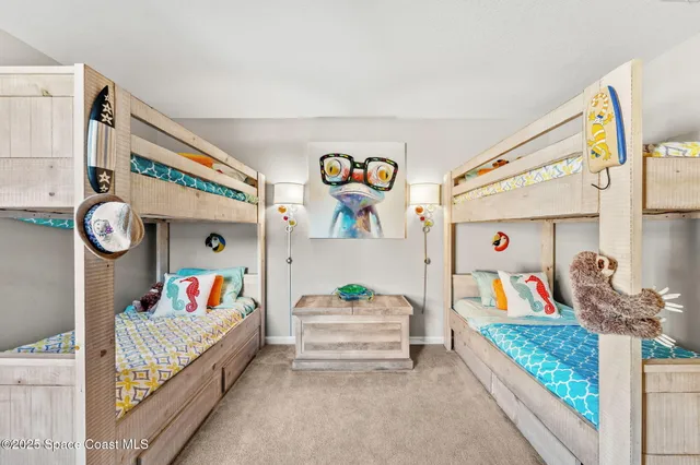 a bedroom with furniture and a flat screen tv