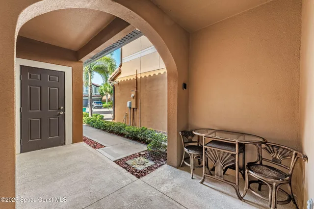 a view of a room that has a bed in it