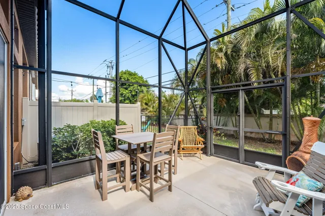 a view of a yard with palm trees
