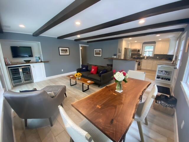 27 Uncatena Road Mashpee, MA 02649 - Photo 13 of 50 a living room with furniture and flat screen tv