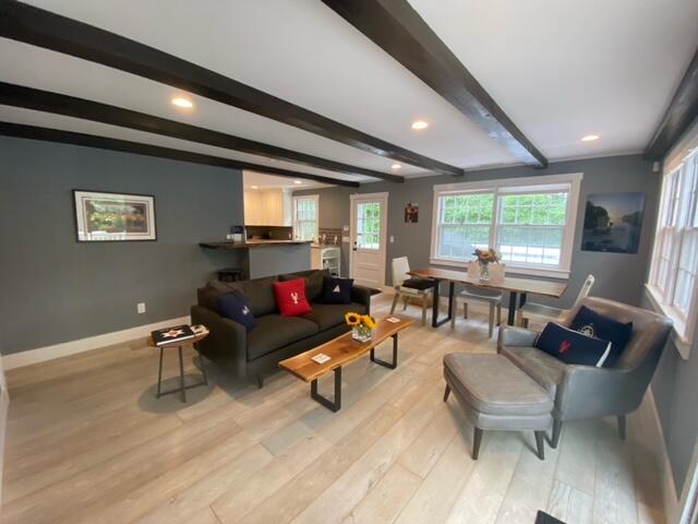 27 Uncatena Road Mashpee, MA 02649 - Photo 18 of 50 a living room with furniture and a large window