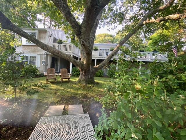 27 Uncatena Road Mashpee, MA 02649 - Photo 9 of 50 a front view of a house with garden