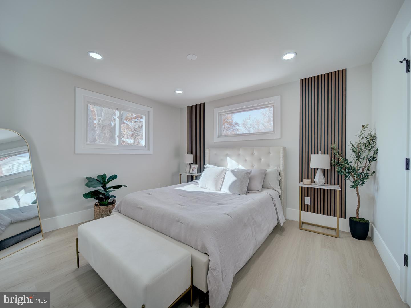 2906 Radius Road Silver Spring, MD 20902 - Photo 16 of 43 a bedroom with a large bed and a potted plant