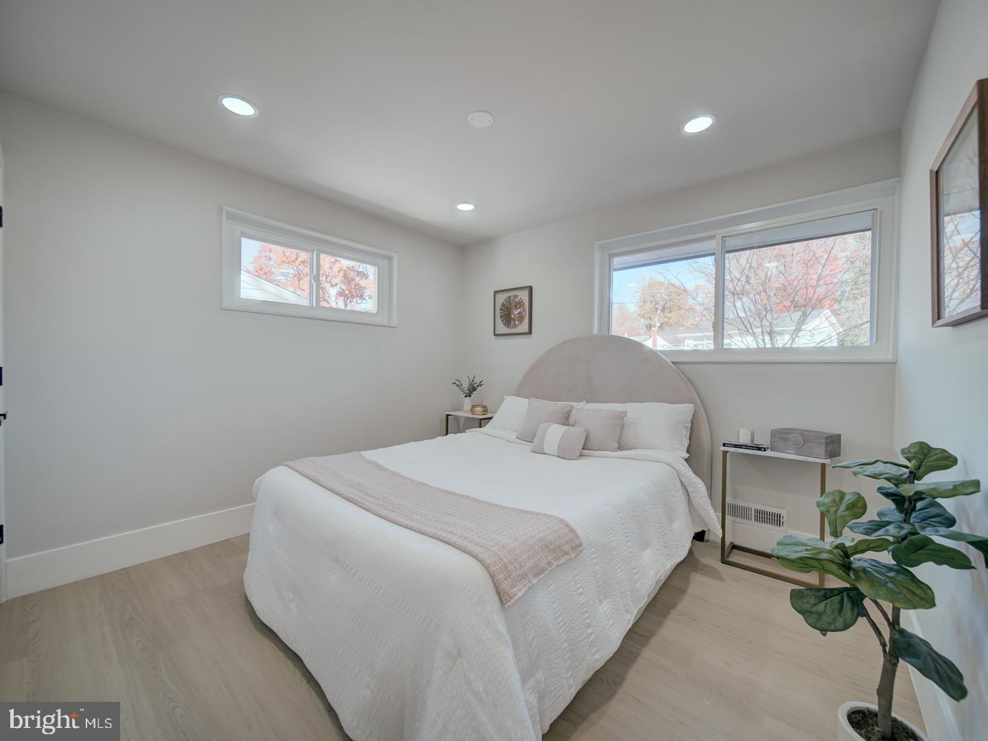 2906 Radius Road Silver Spring, MD 20902 - Photo 21 of 43 a bedroom with a bed and a potted plant
