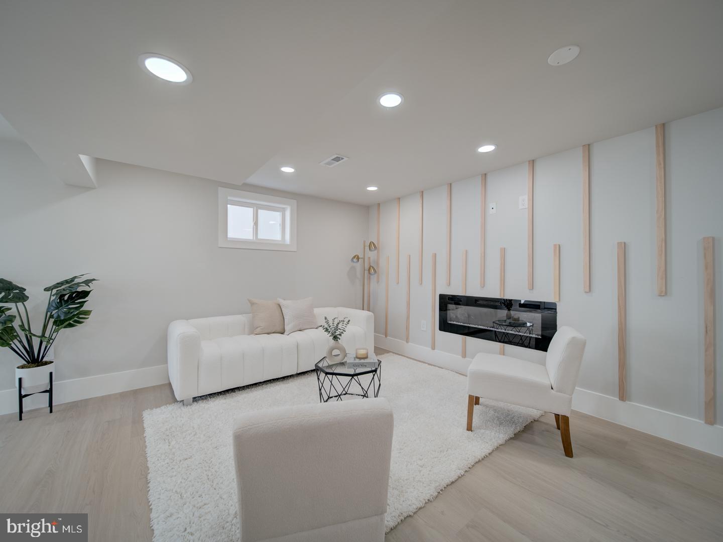 2906 Radius Road Silver Spring, MD 20902 - Photo 27 of 43 a living room with furniture and a potted plant
