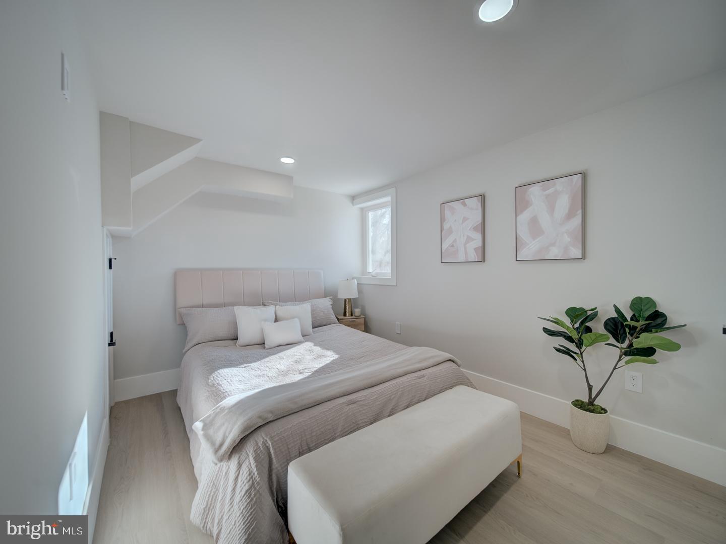 2906 Radius Road Silver Spring, MD 20902 - Photo 34 of 43 a bedroom with a bed and a potted plant