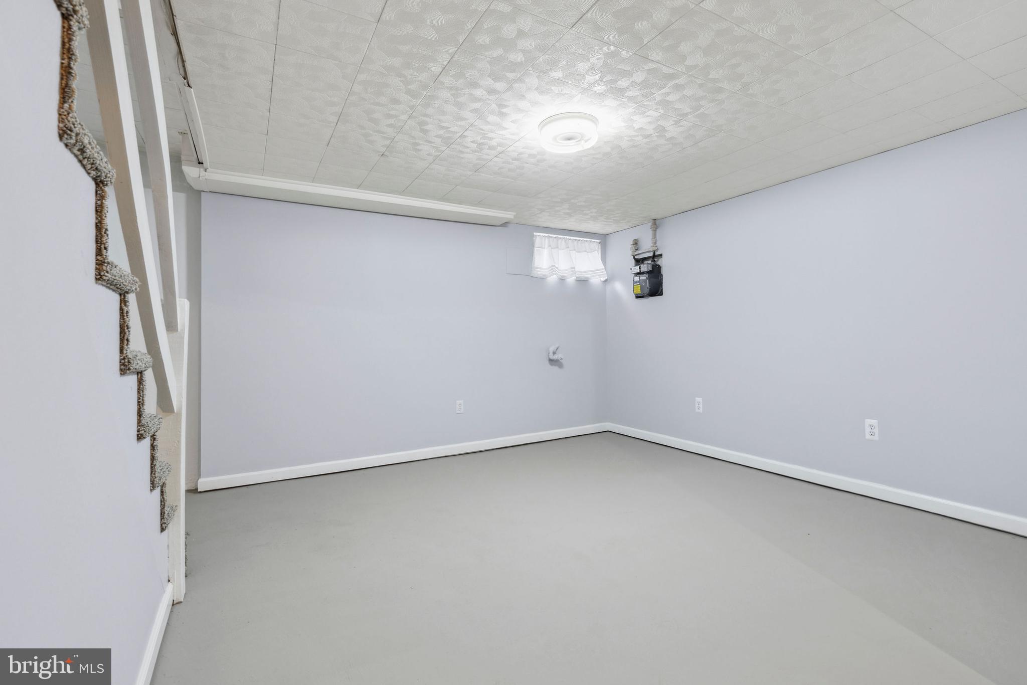 3418 Dunran Road Baltimore, MD 21222 - Photo 15 of 19 an empty room with a empty space and windows