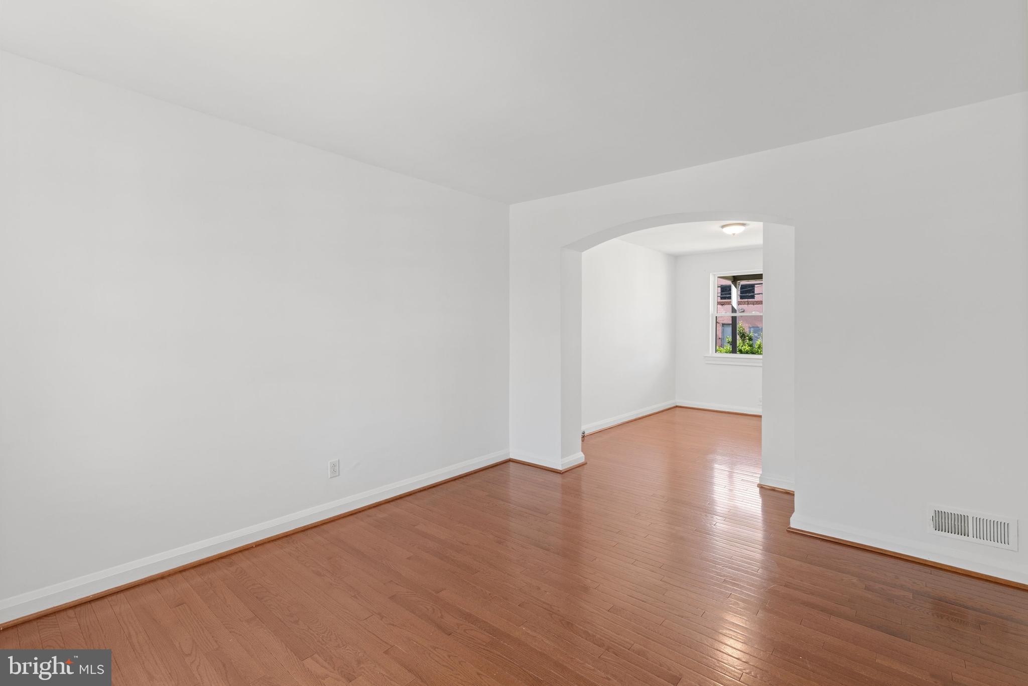 3418 Dunran Road Baltimore, MD 21222 - Photo 8 of 19 a view of an empty room with wooden floor