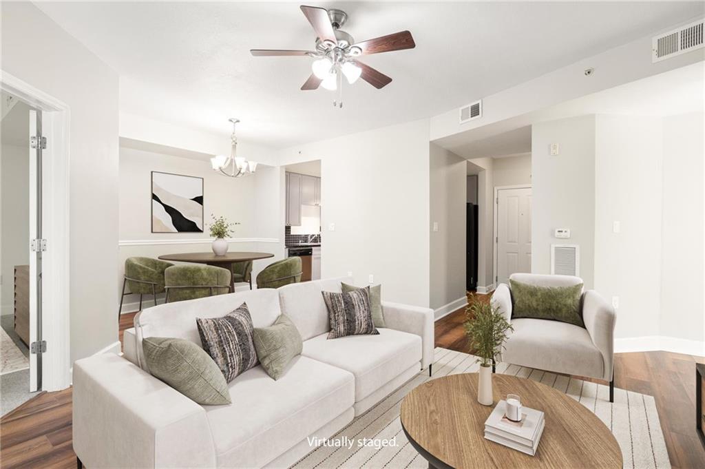 230 East Ponce De Leon Avenue, Unit 104 Decatur, GA 30030 - Photo 15 of 27 a living room with furniture and a chandelier
