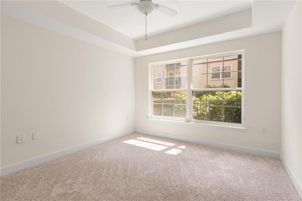 230 East Ponce De Leon Avenue, Unit 104 Decatur, GA 30030 - Photo 17 of 27 an empty room with a empty space and windows