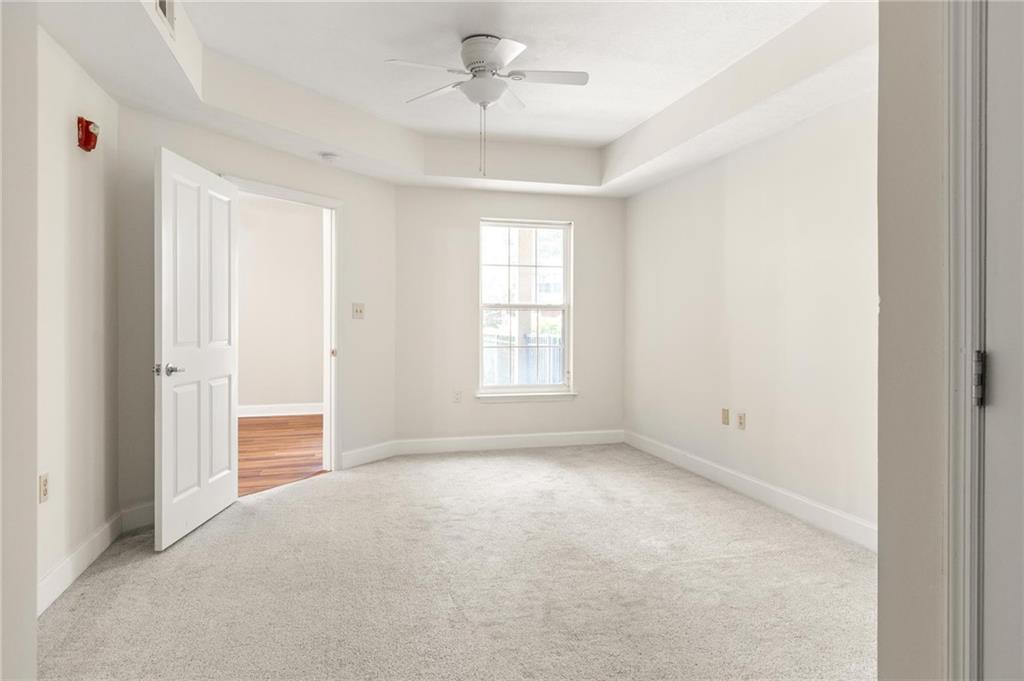 230 East Ponce De Leon Avenue, Unit 104 Decatur, GA 30030 - Photo 20 of 27 a view of an empty room with a window