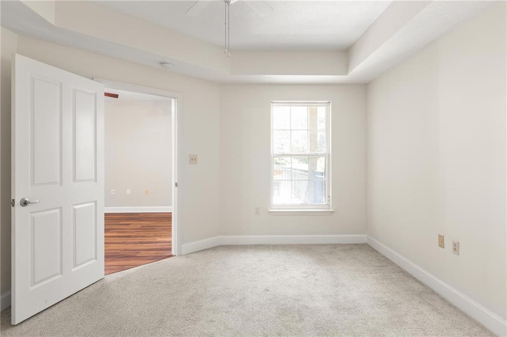 230 East Ponce De Leon Avenue, Unit 104 Decatur, GA 30030 - Photo 22 of 27 an empty room with windows