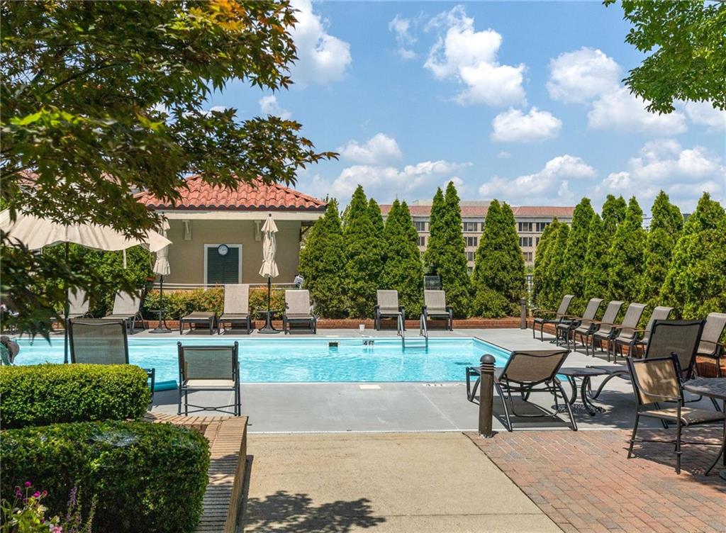 230 East Ponce De Leon Avenue, Unit 104 Decatur, GA 30030 - Photo 3 of 27 a view of a backyard with sitting area