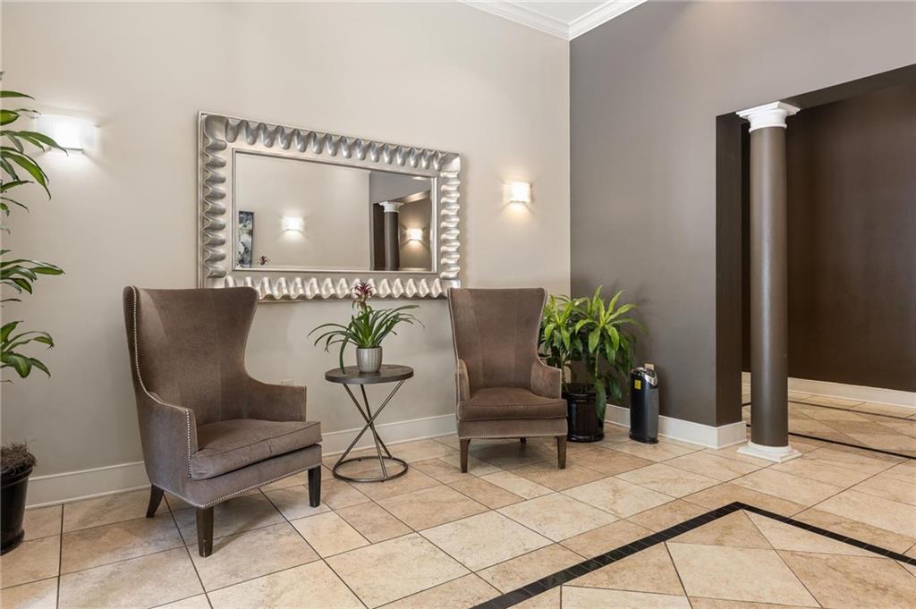 230 East Ponce De Leon Avenue, Unit 104 Decatur, GA 30030 - Photo 5 of 27 a view of a livingroom with furniture and a potted plant