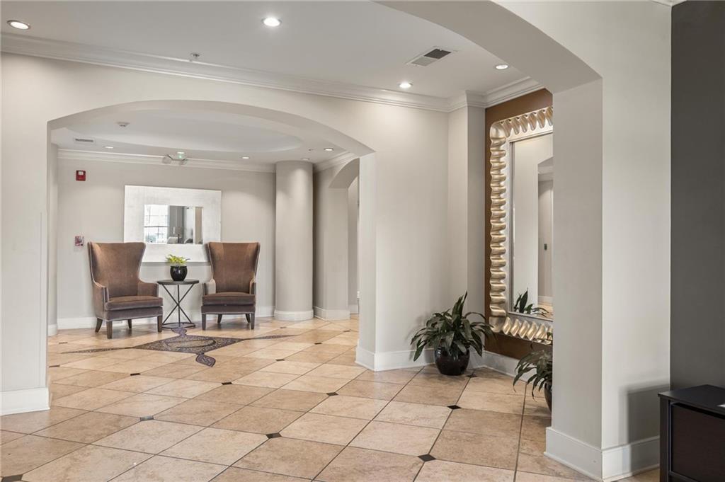 230 East Ponce De Leon Avenue, Unit 104 Decatur, GA 30030 - Photo 7 of 27 a view of a dining hall with furniture and a potted plant